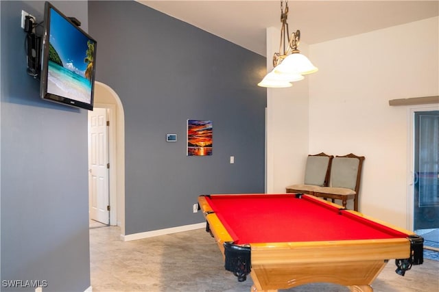 rec room with arched walkways, pool table, and baseboards