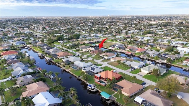 aerial view with a water view and a residential view