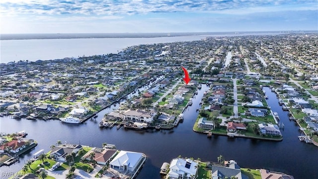 bird's eye view with a water view and a residential view