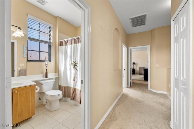 full bath featuring visible vents, toilet, tile patterned floors, curtained shower, and vanity