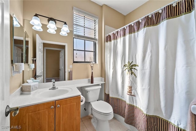 bathroom with toilet, curtained shower, tile patterned flooring, and vanity