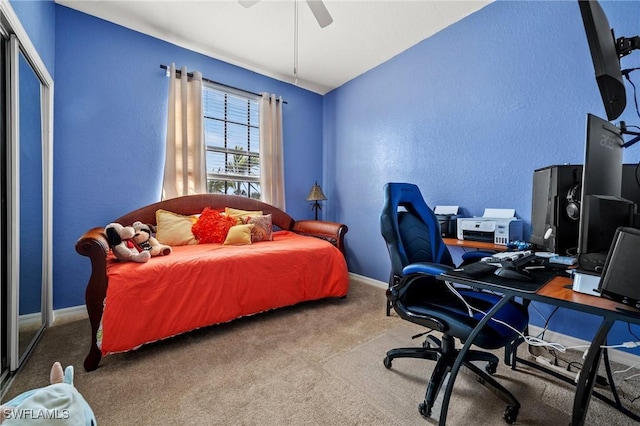 bedroom featuring a ceiling fan, carpet, and baseboards