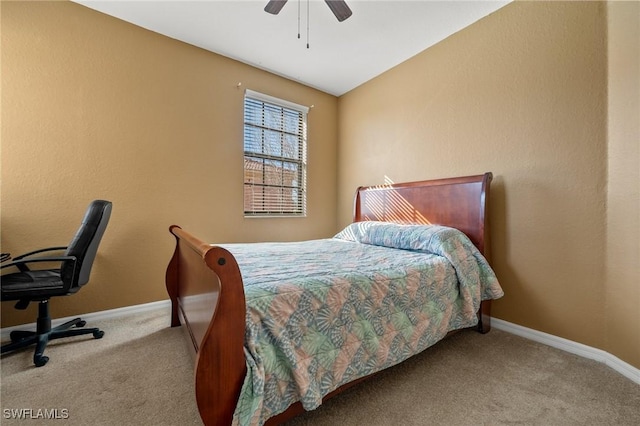 bedroom with a ceiling fan, carpet, and baseboards