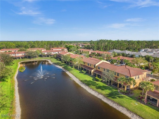 birds eye view of property with a water view and a residential view