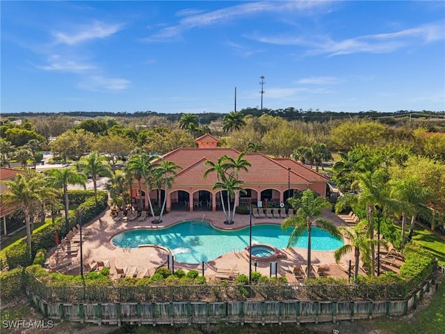 view of pool featuring a patio area and a pool with connected hot tub