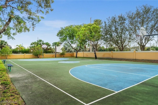 view of sport court featuring community basketball court and fence