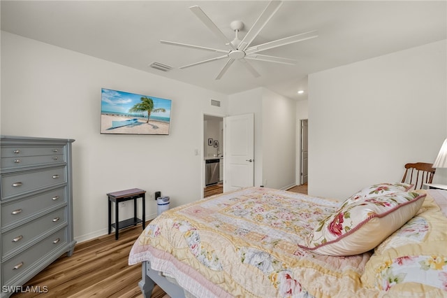 18512 Marlin Kite Ln, North Fort Myers, FL 33917 - bedroom featuring a ceiling fan, baseboards, visible vents, and wood finished floors