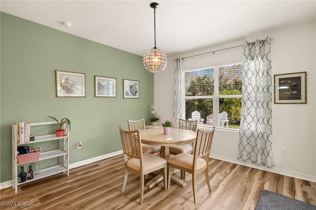 18512 Marlin Kite Ln, North Fort Myers, FL 33917 - dining area with wood finished floors and baseboards