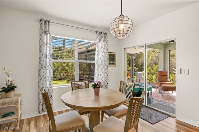 18512 Marlin Kite Ln, North Fort Myers, FL 33917 - dining room featuring light wood-style floors and baseboards