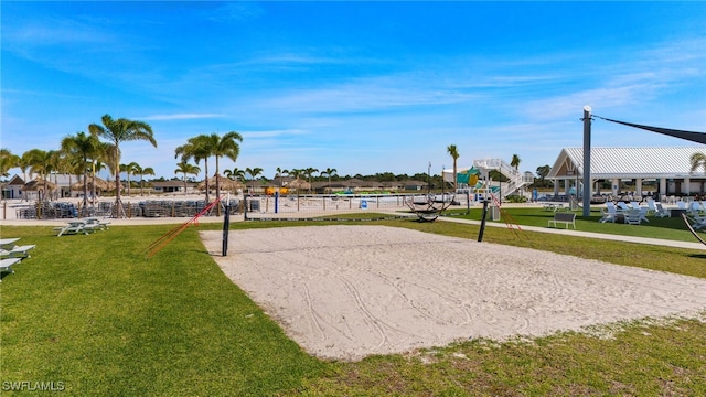 18512 Marlin Kite Ln, North Fort Myers, FL 33917 - surrounding community with a lawn and volleyball court