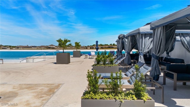 18512 Marlin Kite Ln, North Fort Myers, FL 33917 - view of swimming pool with a water view, a patio area, and a view of the beach