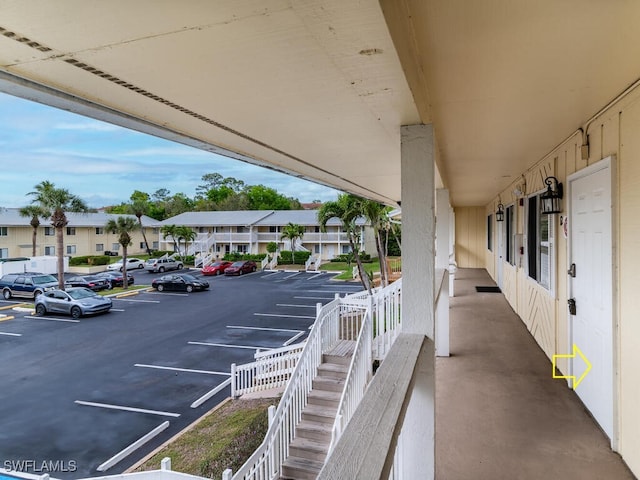 uncovered parking lot featuring a residential view