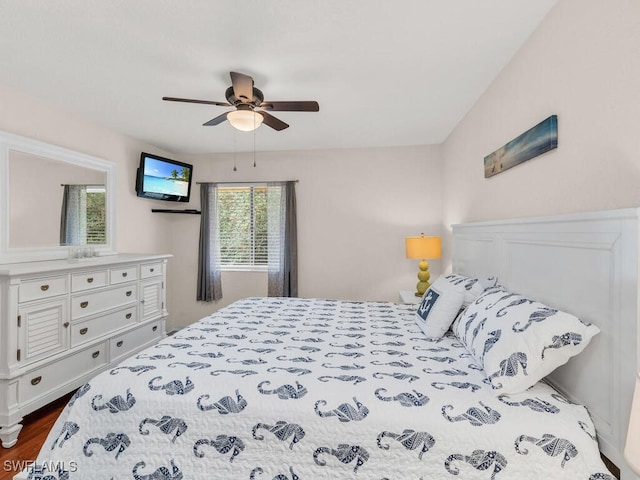 bedroom featuring dark wood finished floors and a ceiling fan