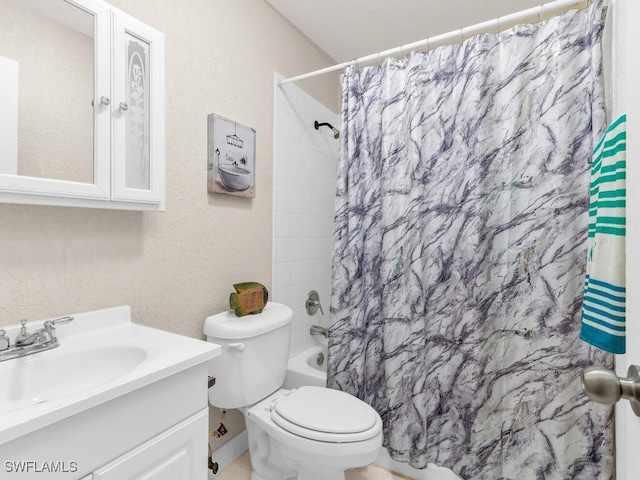 full bathroom featuring shower / bath combo, vanity, and toilet