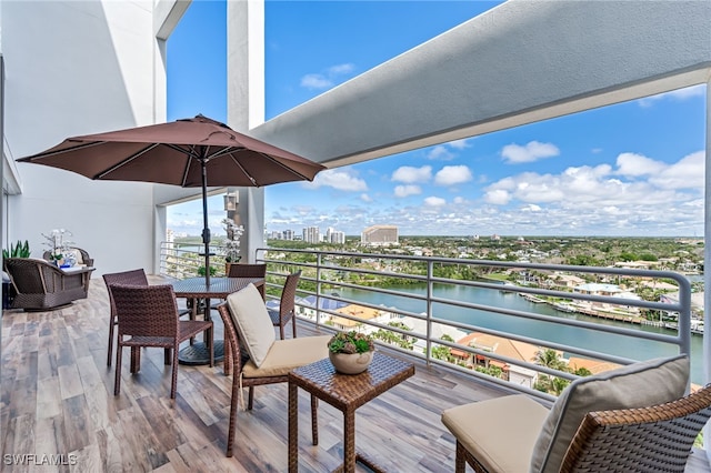exterior space with a water view and a city view