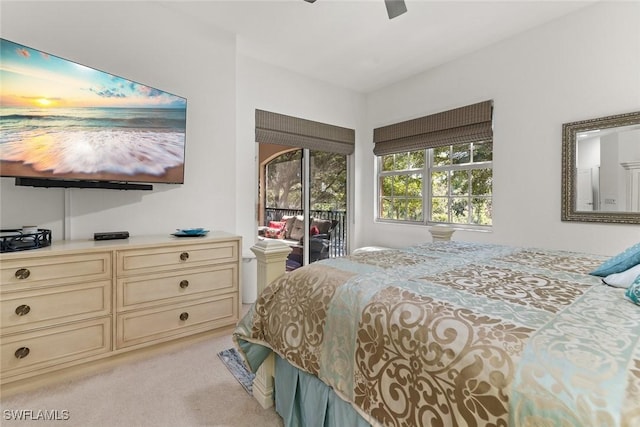 bedroom with ceiling fan, access to outside, and light colored carpet