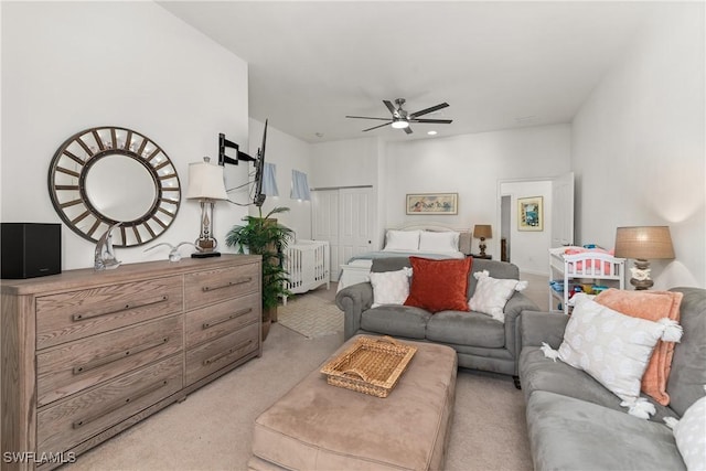 interior space featuring light carpet and ceiling fan