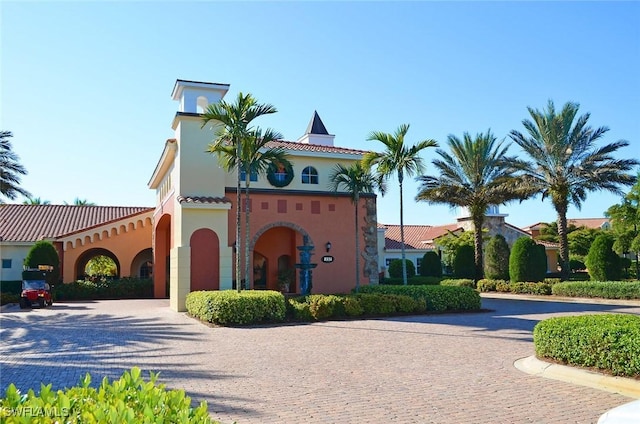 view of property featuring decorative driveway