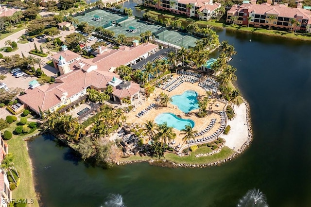 drone / aerial view featuring a water view and a residential view