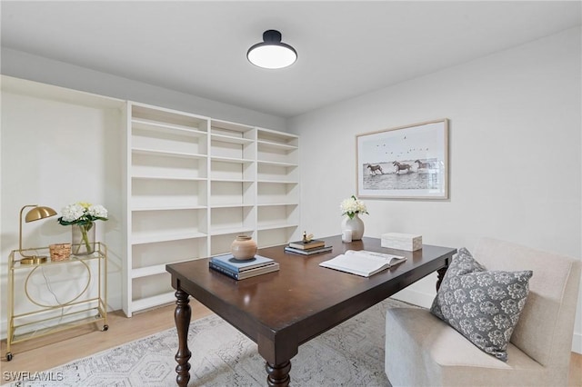 home office with wood finished floors