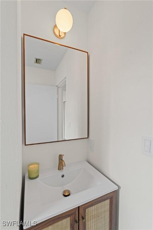 bathroom with visible vents and vanity