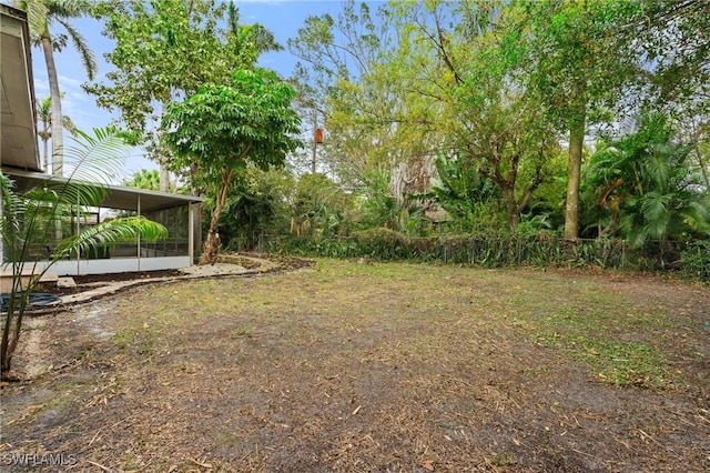 view of yard with a sunroom