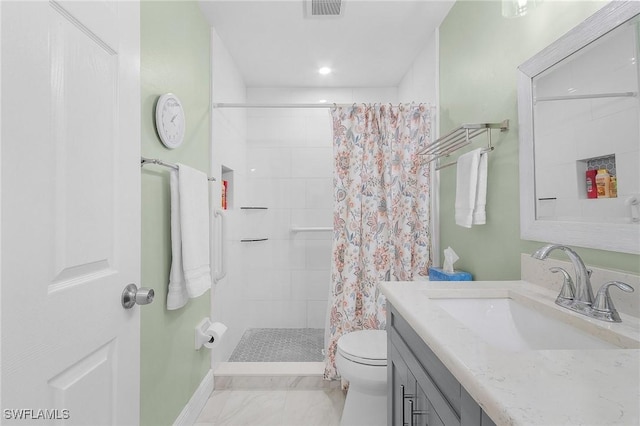 bathroom with visible vents, toilet, marble finish floor, a tile shower, and vanity