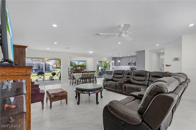 living room featuring a ceiling fan, recessed lighting, and visible vents