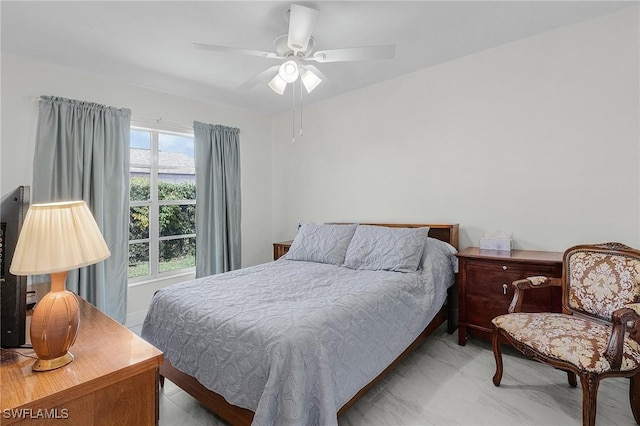 bedroom featuring marble finish floor and ceiling fan