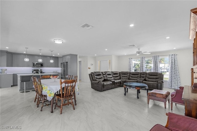 dining area with a ceiling fan, visible vents, and recessed lighting