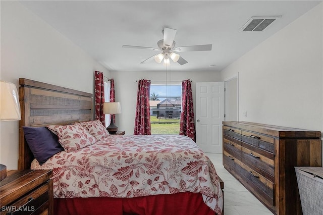 bedroom with visible vents and a ceiling fan