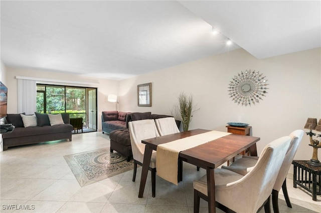 dining area featuring light tile patterned flooring