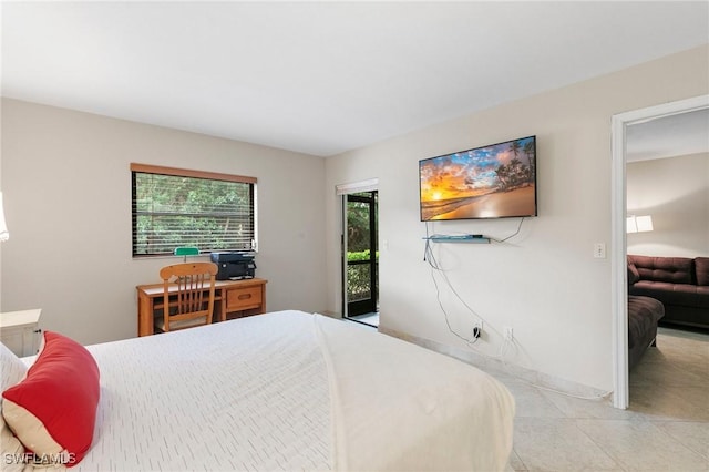 bedroom with access to exterior and light tile patterned floors