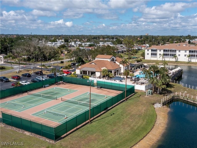 drone / aerial view with a residential view and a water view