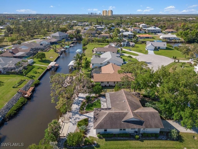 bird's eye view with a residential view and a water view