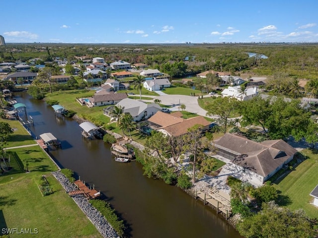 birds eye view of property with a residential view and a water view