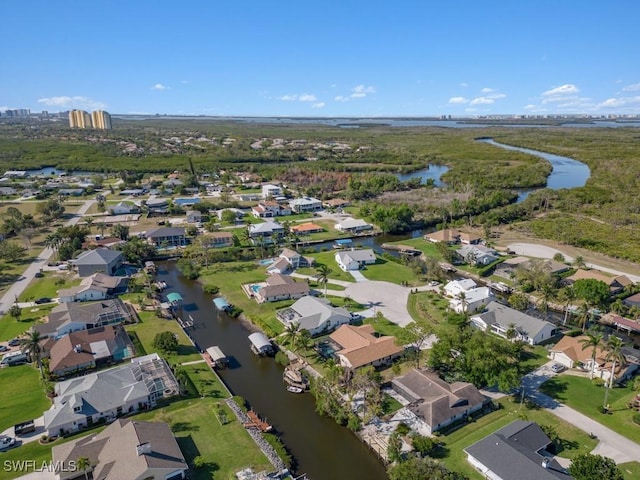 aerial view featuring a residential view and a water view