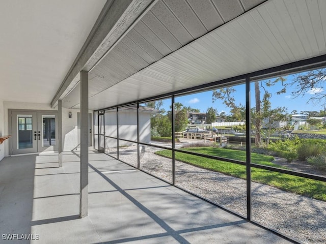 unfurnished sunroom featuring french doors