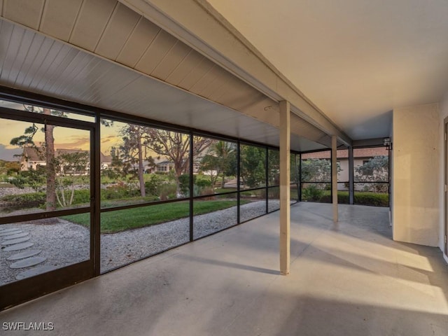 unfurnished sunroom with plenty of natural light