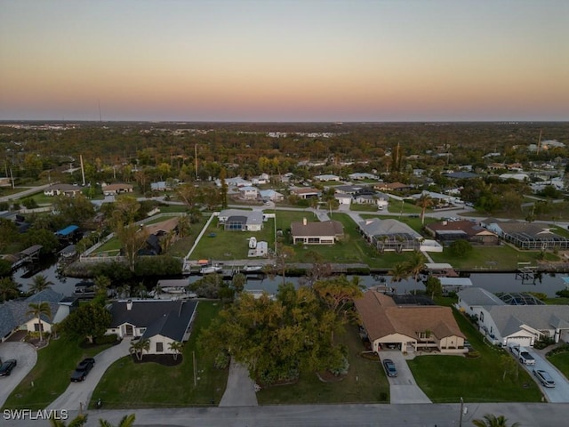 bird's eye view featuring a residential view and a water view