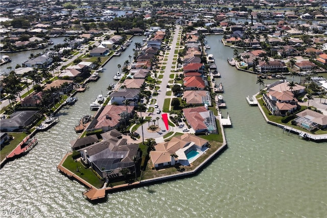 birds eye view of property featuring a water view and a residential view