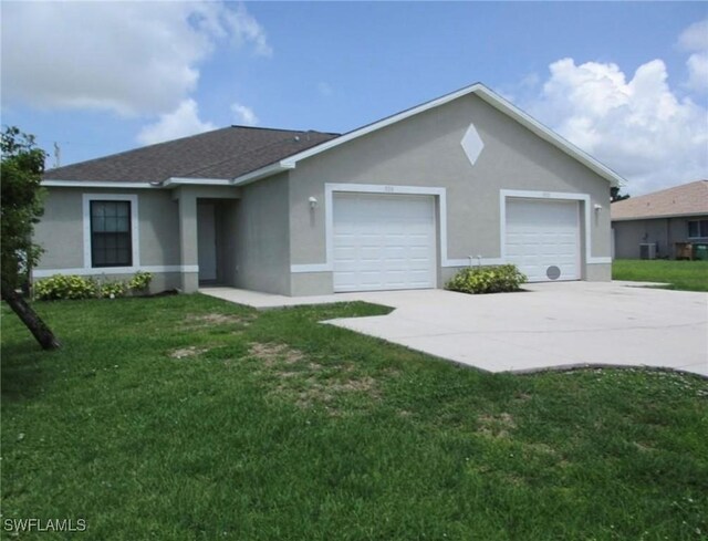 single story home with a front yard, a garage, driveway, and stucco siding