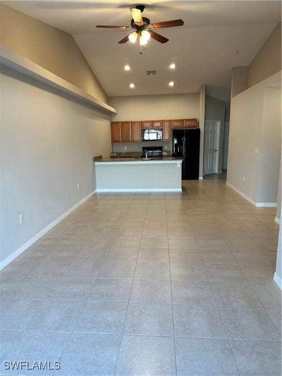 unfurnished living room with lofted ceiling, baseboards, visible vents, and ceiling fan