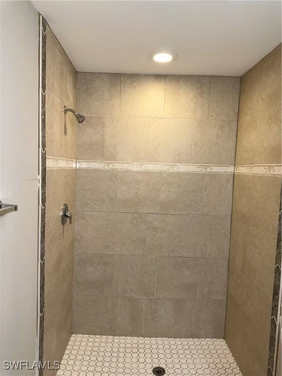 bathroom with a tile shower