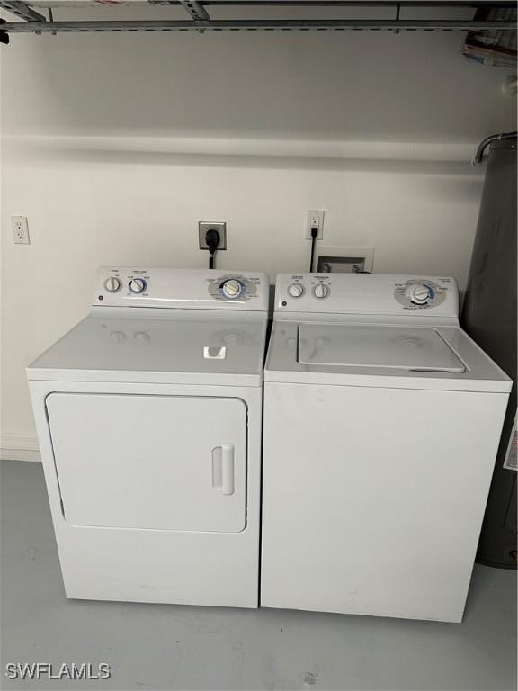 laundry room with laundry area and washing machine and clothes dryer