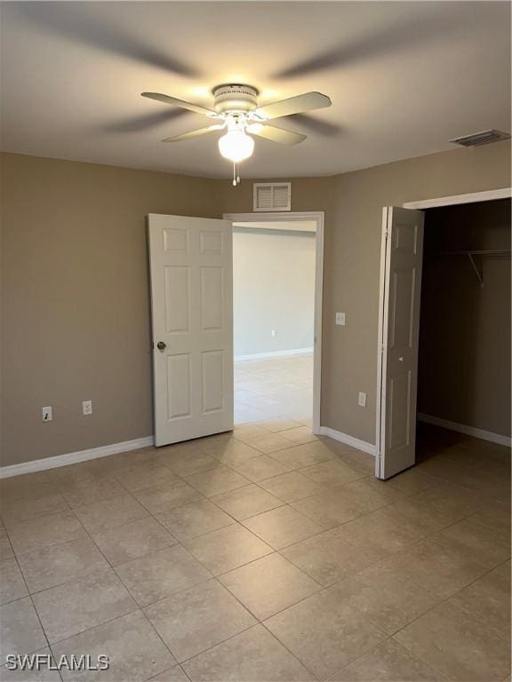 unfurnished bedroom with visible vents, baseboards, and a closet