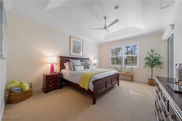 bedroom featuring a tray ceiling, visible vents, ornamental molding, light carpet, and baseboards