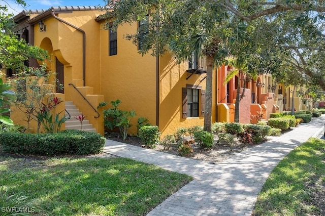 view of side of property featuring stucco siding