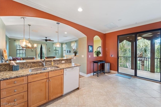 kitchen with dishwasher, light stone counters, open floor plan, hanging light fixtures, and a sink