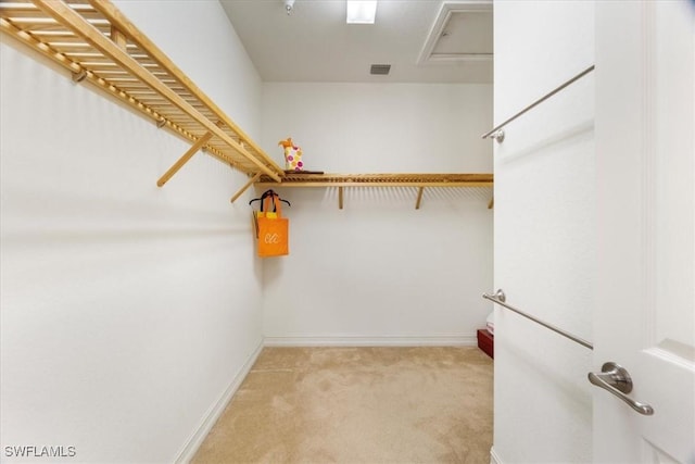 spacious closet with light carpet and visible vents